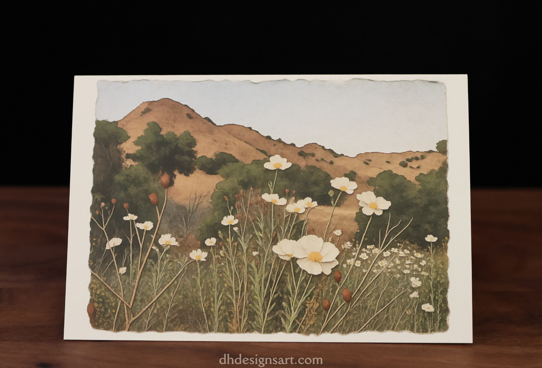 Blank notecard with an artistic depiction of a California landscape with Matilija poppy flowers and mountains. dhdesignsart.com