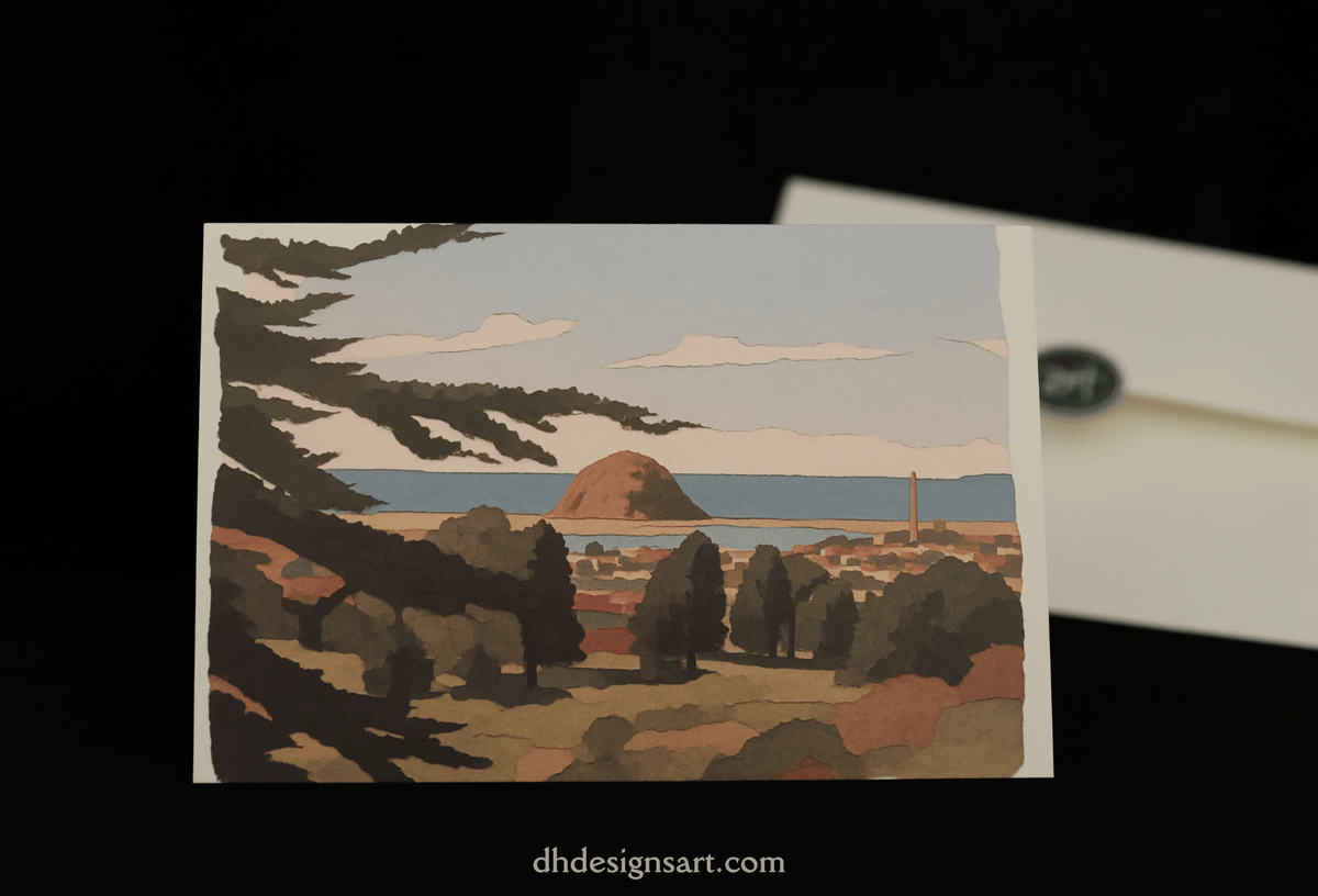 A notecard featuring a stylized landscape illustration of Morro Bay, CA, with trees, Morro Rock, the ocean, and sky, displayed against a black background with part of a white envelope visible behind it.