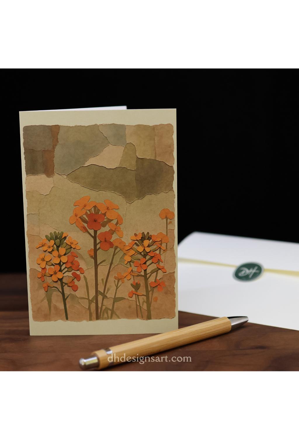 Blank notecard featuring orange Yosemite Western Wallflowers set on a wooden desk with a pen and envelope.